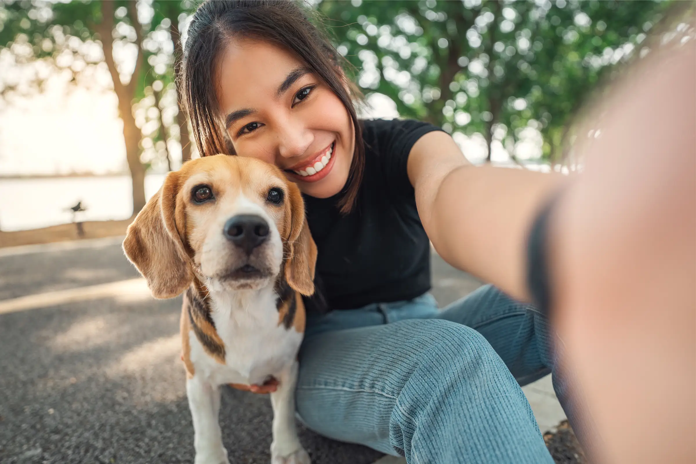 Girl taking selfie with her dog