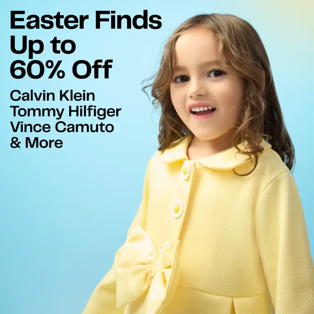 Smiling little girl in yellow with blue background